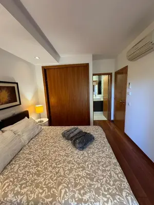 a bedroom with a bed with a pillow on it at Praia da Luz - Resort in Luz