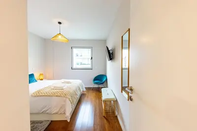 a small bedroom with a bed and a window at Formosa Stay IV by YOUR KEY in Funchal