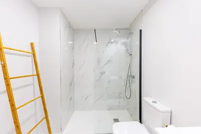 a bathroom with a shower and a toilet at Formosa Stay IV by YOUR KEY in Funchal