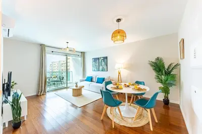 a living room with a table and chairs and a couch at Formosa Stay IV by YOUR KEY in Funchal
