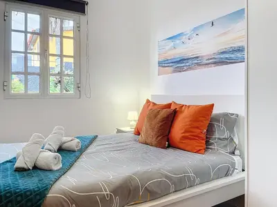 a bedroom with a bed with orange pillows at Casa Moreira by AH in Caniçal