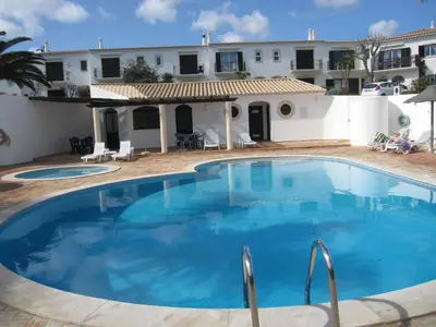 a large swimming pool in front of a house at Villa Figueira in Figueira