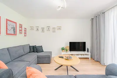 a living room with a couch and a table at Madeira Dreams in Caniço