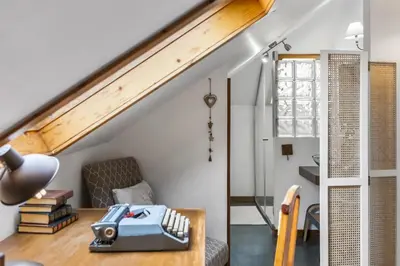 a living room with a table and a chair at Villa Piedade by Homie in Canhas