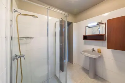 a laundry room with a washing machine and a sink at João Loft I by Mth in Campanário