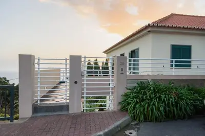 a stairway with a white rail next to a building at João Loft I by Mth in Campanário