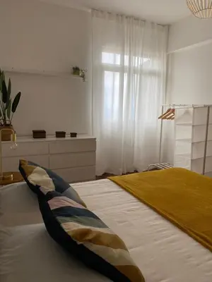 a bedroom with a bed with a pillow on it at Cantinho dos M&M in Funchal