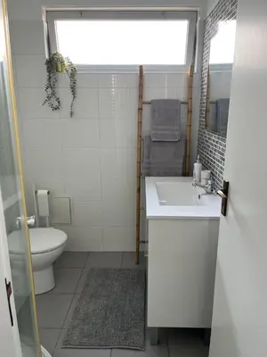 a bathroom with a sink and a toilet at Cantinho dos M&M in Funchal