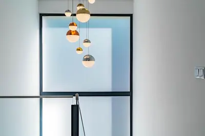 a glass door with several lights hanging from it at Casa Luciano in Estreito da Calheta