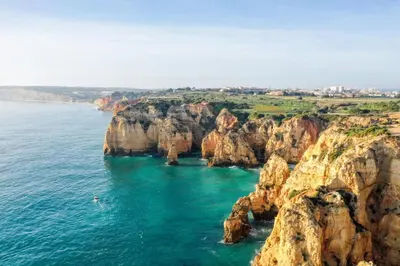 an aerial view of the ocean and cliffs at Green Beach Ocean View, Porto de Mós VR13 in Lagos