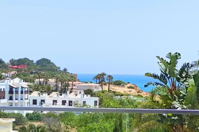 a view of the ocean from the balcony of a house at Home By The Sea Ocean View Apartment in Lagos