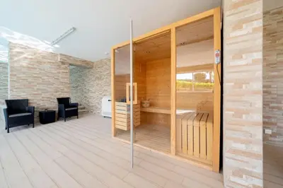 a room with glass doors and chairs in a building at MaBelle Luxury Ocean View Apartment in Lagos