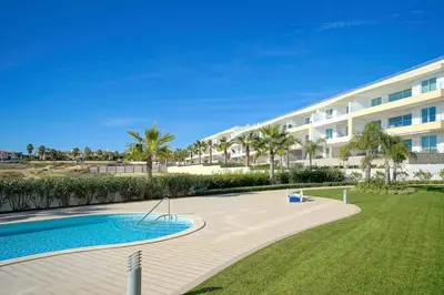 a resort with a swimming pool and a building at MaBelle Luxury Ocean View Apartment in Lagos