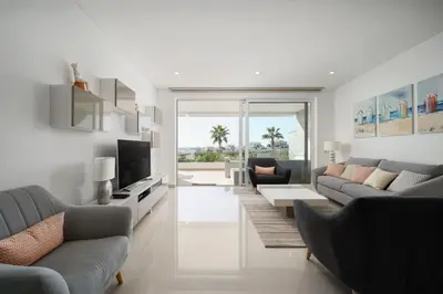 a living room with two couches and a television at MaBelle Luxury Ocean View Apartment in Lagos