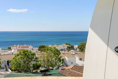 a view of a city and the ocean at Shabby Chique Surf Beach and Ocean in Luz
