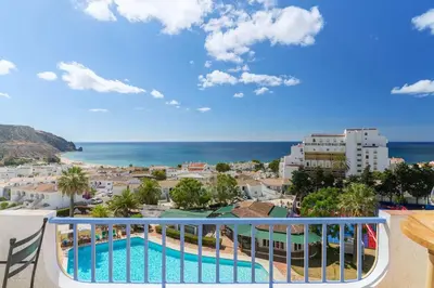 a balcony with a view of the ocean at Shabby Chique Surf Beach and Ocean in Luz