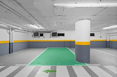an empty room with a green floor in a building at Studio Carmo in Funchal