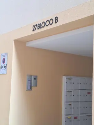 a sign on the wall of a office with a door at Studio Carmo in Funchal