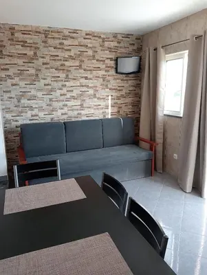 a white building with a bench in front of it at Brisas da Raposeira in Raposeira