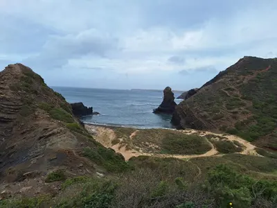 a view of the ocean from a hill with rocks at Brisas da Raposeira in Raposeira