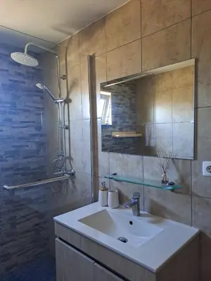 a bathroom with a sink and a shower at Brisas da Raposeira in Raposeira