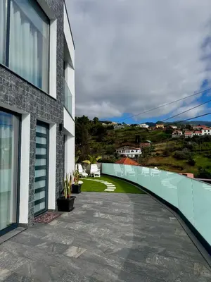 a balcony of a house with a walkway at Calheta Nest in Calheta