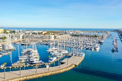 an aerial view of a marina with boats in the water at Orange Beach Ocean View, Porto de Mós VR29 in Lagos
