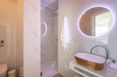 a bathroom with a sink and a mirror at Blue Beach Ocean View, Porto de Mós VR14 in Lagos