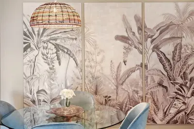 a dining room with a wall mural of plants at Exquisite Ocean Apartment by Homie in Caniço