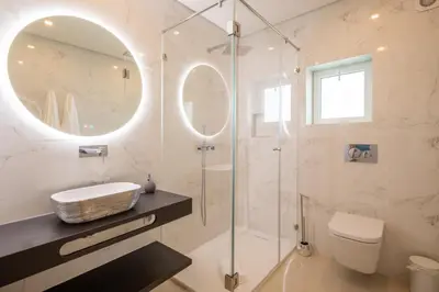 a bathroom with a shower and a sink and a mirror at Yellow Beach Ocean View, Porto de Mós VR38 in Lagos