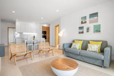 a living room with a couch and a table at Yellow Beach Ocean View, Porto de Mós VR38 in Lagos