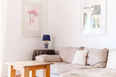 a living room with a couch and a table at GuestReady - Marvellous ocean view in Caniço in Caniço