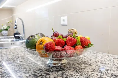 a bowl of fruit on a counter in a kitchen at Ocean Lido in Funchal