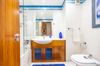 a bathroom with a sink and a shower at Ocean Lido in Funchal