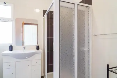 a bathroom with a shower and a sink at GuestReady - Peaceful getaway near the beach in Machico