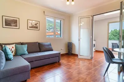 a living room with a couch and a table at GuestReady - Peaceful getaway near the beach in Machico