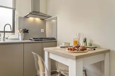 a kitchen with a table with a plate of food on it at Cozy Apartments by Homie in Porto Moniz