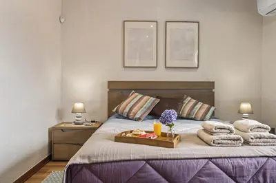 a bedroom with a bed with a tray of towels at Cozy Apartments by Homie in Porto Moniz