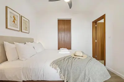 a bedroom with a bed with a hat on it at Skyline Heights by Homie in Funchal
