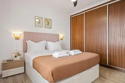 a bedroom with a bed with two towels on it at Skyline Heights by Homie in Funchal