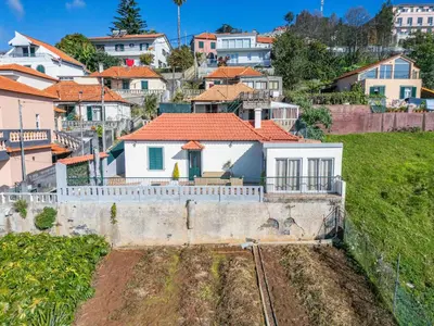 a white house on a hill with houses at Skyline Heights by Homie in Funchal