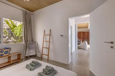 a bathroom with a sink and a mirror at Terraços da Calheta by YMR in Estreito da Calheta