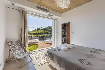 a bathroom with a sink and a mirror at Terraços da Calheta by YMR in Estreito da Calheta