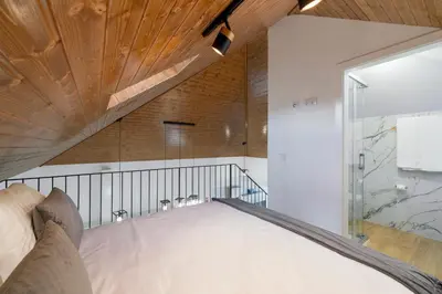 a bathroom with a sink and a mirror at OurMadeira - Chalet Prazeres in Prazeres