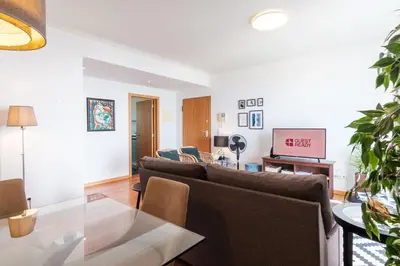 a living room with a couch and a table at GuestReady - Sea breeze in Funchal in Funchal