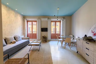 a living room with a couch and a table at GuestReady - Sea breeze in Funchal in Funchal
