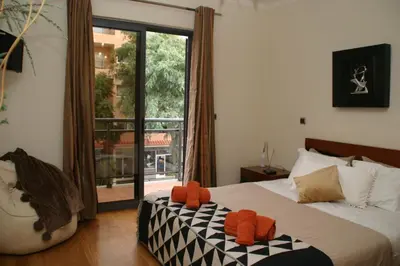 a bedroom with a bed with two stuffed animals on it at Apartamento Batista in Funchal