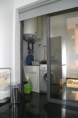 a kitchen with a washer and dryer at Apartamento Batista in Funchal