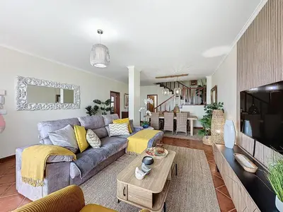 a living room with a couch and a table at Ocean View Botânico in Funchal