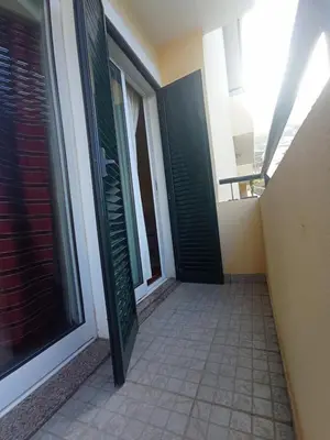 a hallway with green shutters on a building at Village Sun House - Porto Moniz in Porto Moniz